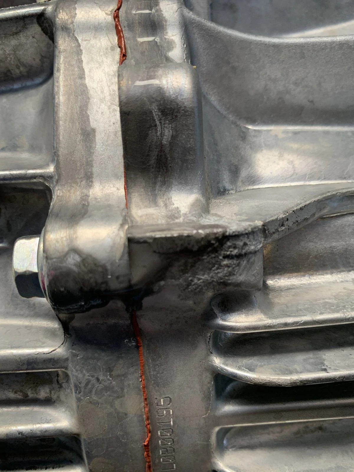 Jeep Gladiator Clear Liquid dripping from bottom of transmission.  Leaving light stains on concrete.  What is this?  AC condensate? IMG_3405