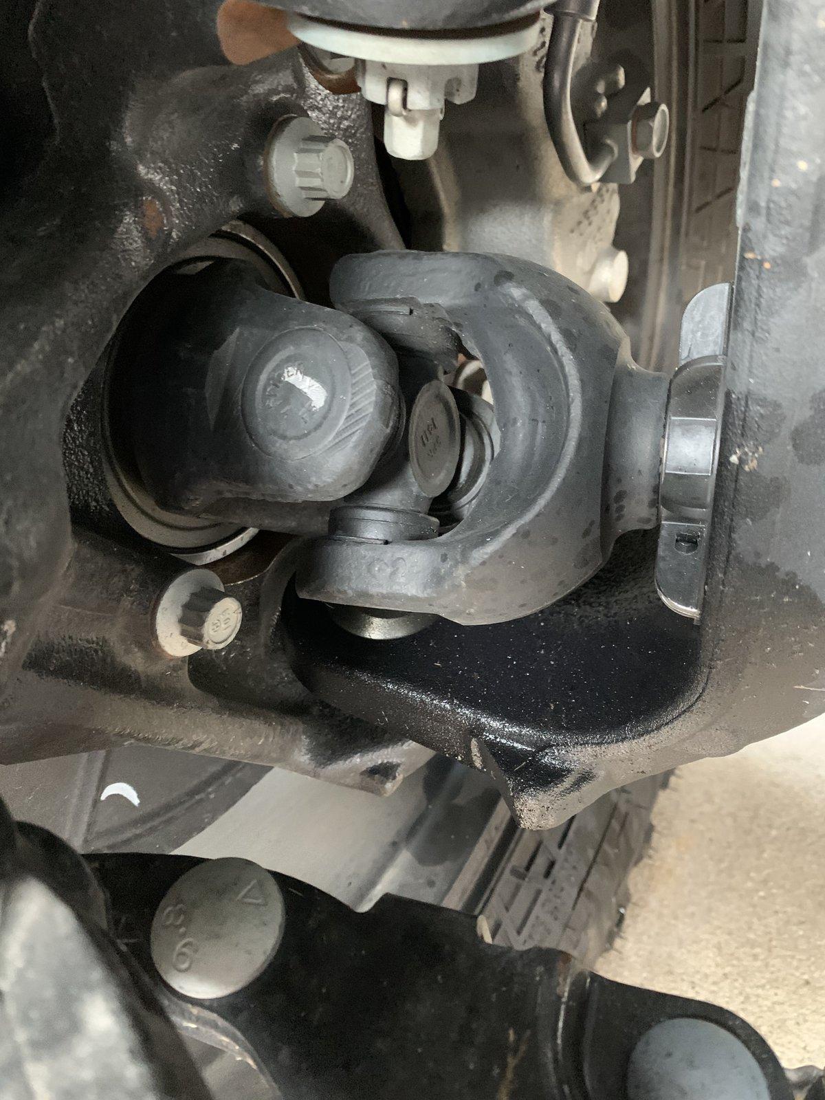 Jeep Gladiator Clear Liquid dripping from bottom of transmission.  Leaving light stains on concrete.  What is this?  AC condensate? IMG_3410