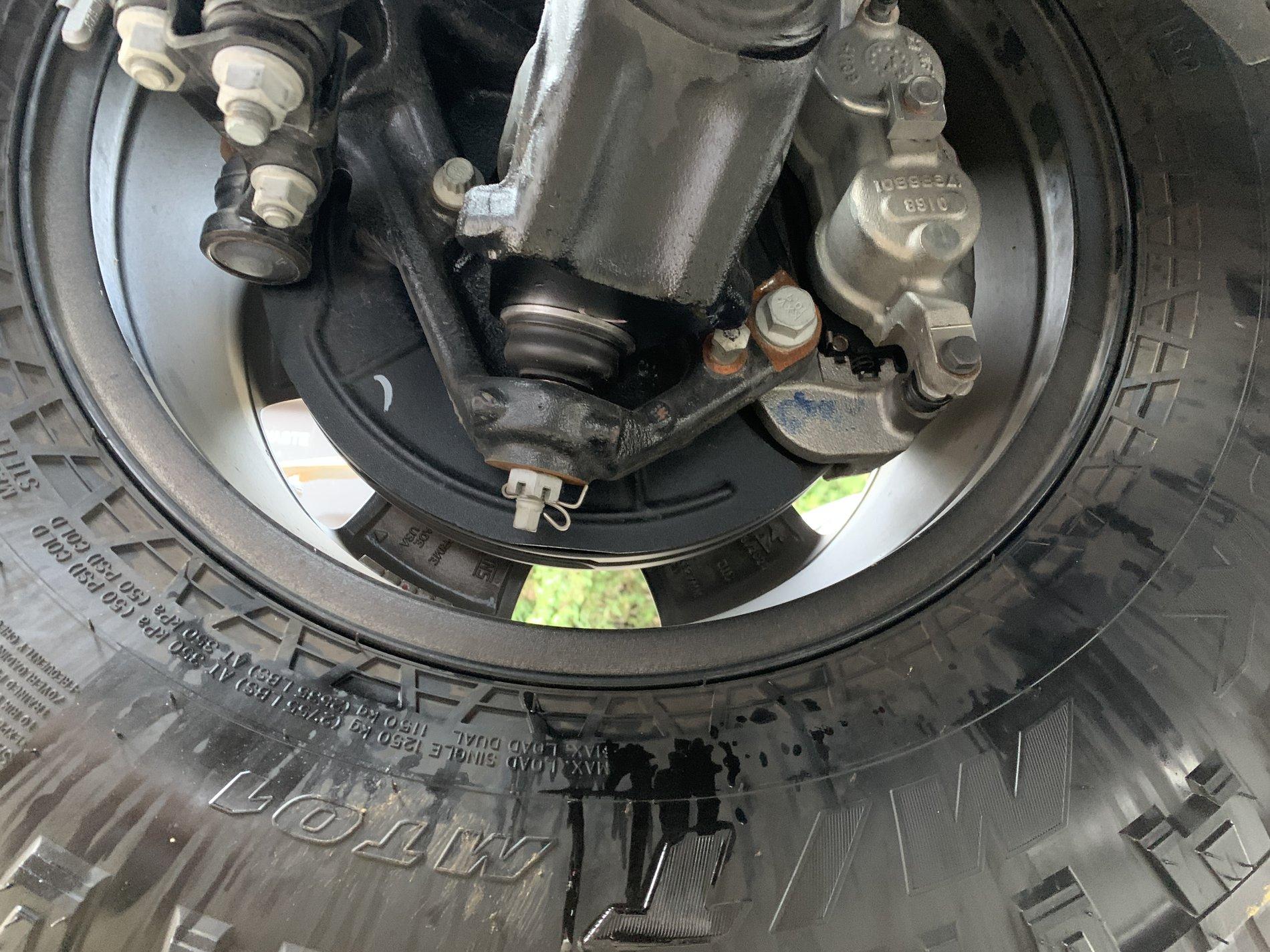 Jeep Gladiator Clear Liquid dripping from bottom of transmission.  Leaving light stains on concrete.  What is this?  AC condensate? IMG_3416