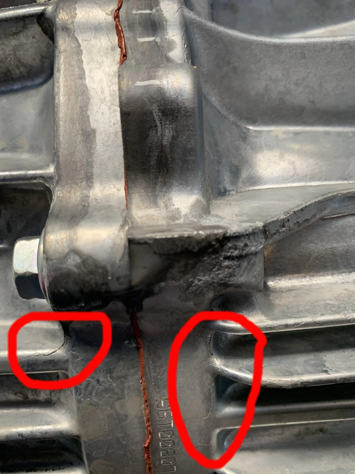 Jeep Gladiator Clear Liquid dripping from bottom of transmission.  Leaving light stains on concrete.  What is this?  AC condensate? IMG_3405