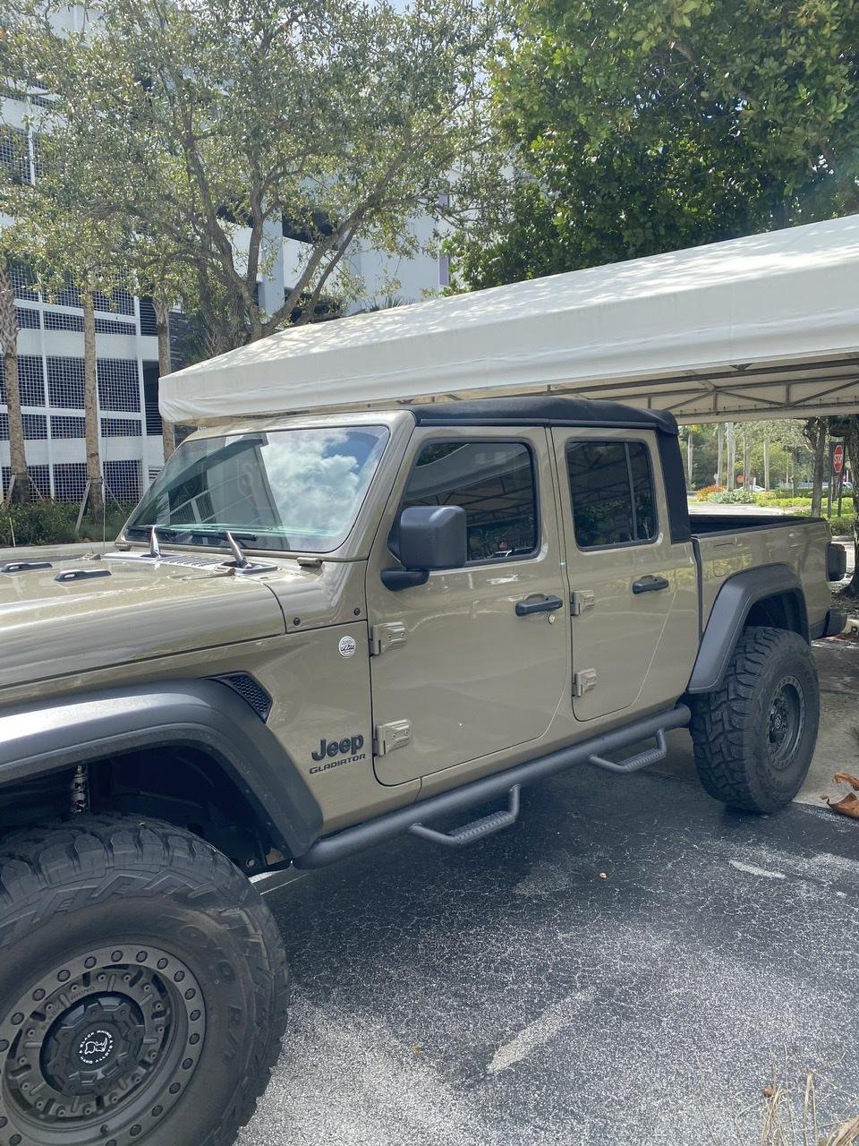 Jeep Gladiator Soft top shows toughness from downed tree 6b5726a6-2b57-407f-aee7-09601c7f4a31-jpe
