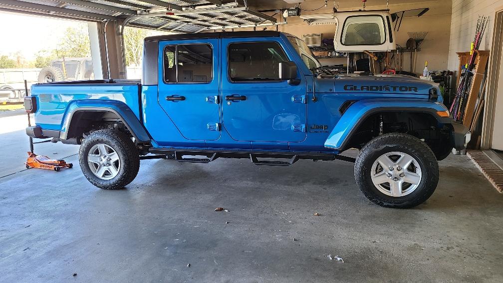 Jeep Gladiator Bruiser...hydro blue and black sport s diesel. b4 tires