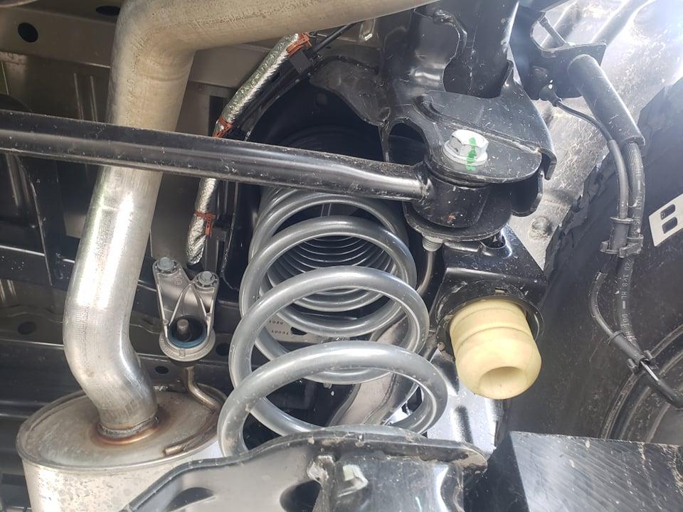 Jeep Gladiator UPDATE: DELIVERED!! Rubicon Diesel: Factory order and Modifications from AEV help with some decisions, tires, wheels, transmission, transfer case pic glad under coil 212220679_1149368805543388_7867547240135332516_n