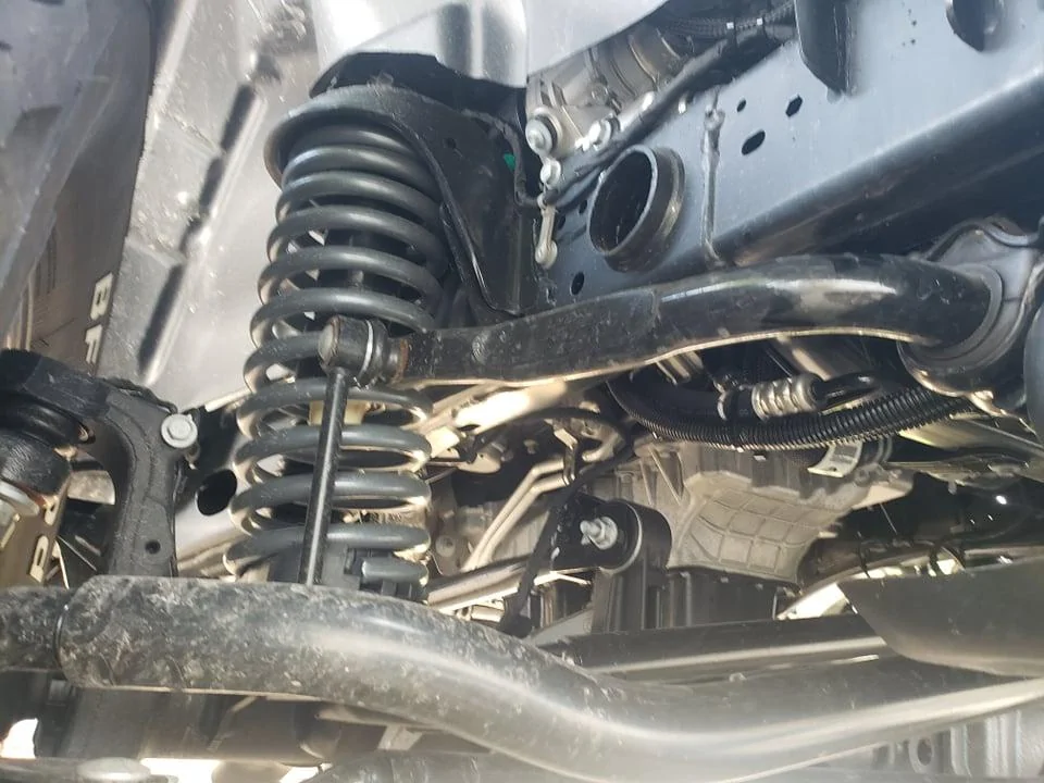 Jeep Gladiator UPDATE: DELIVERED!! Rubicon Diesel: Factory order and Modifications from AEV help with some decisions, tires, wheels, transmission, transfer case pic glad underneith control arm 212796135_401910087830126_4954717453563700163_n