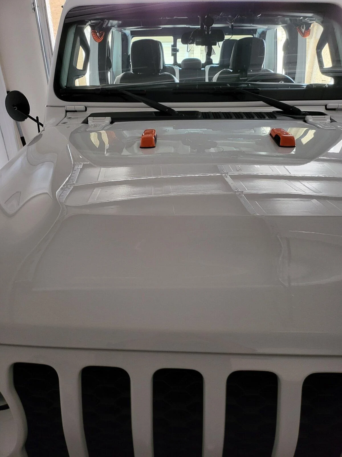 Jeep Gladiator Very dumb question: What are those little black things on the Sport hood called? 20211109_145419