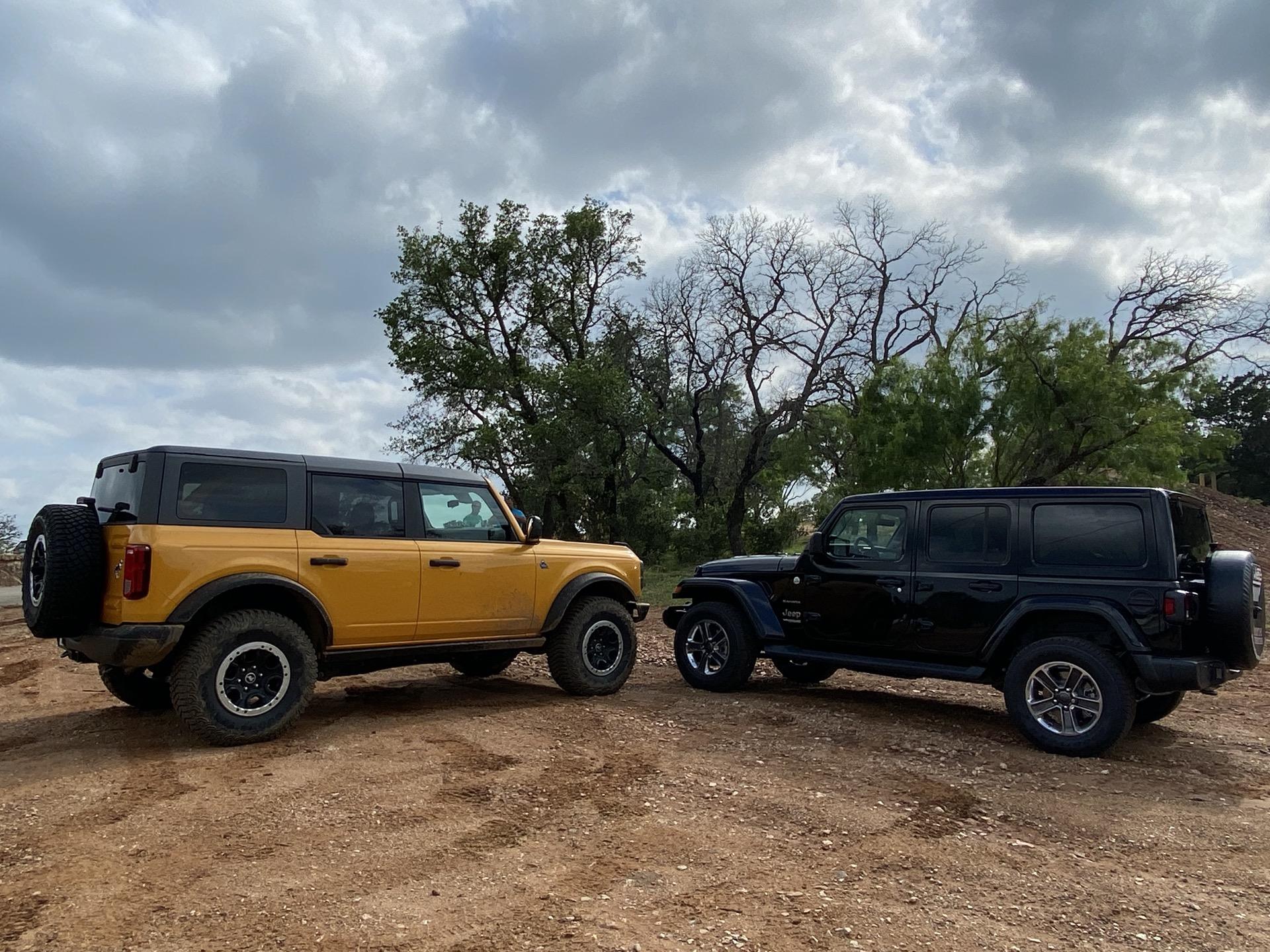 Jeep Gladiator I test drove the 2.3L 4 cylinder Bronco on Sunday 2021-jeep-wrangler-sahara-black-and-2021-ford-bronco-black-diamond-yellow_100797545_h