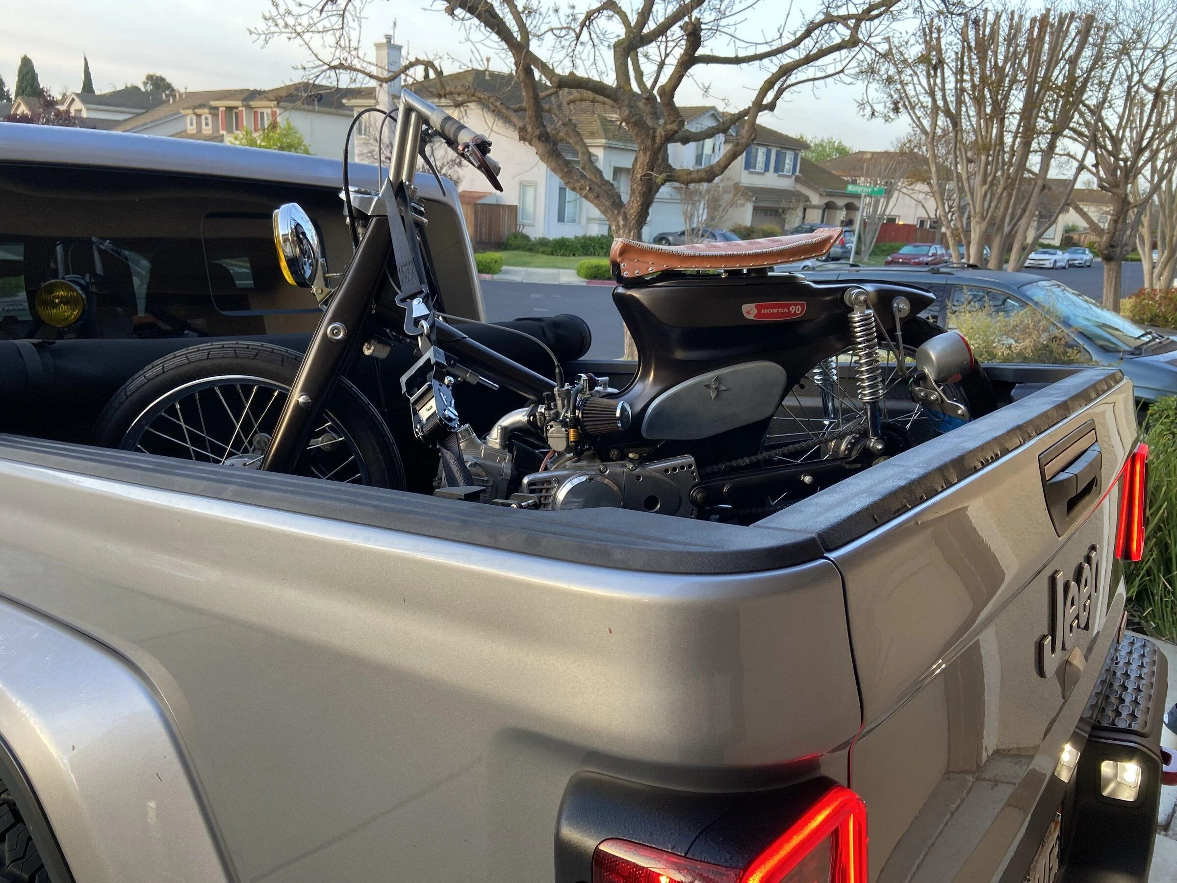 Jeep Gladiator Motorcycle (not a dirt bike) in the bed. 858E971C-DA3A-4DB5-B33C-C64FB3D1BD82
