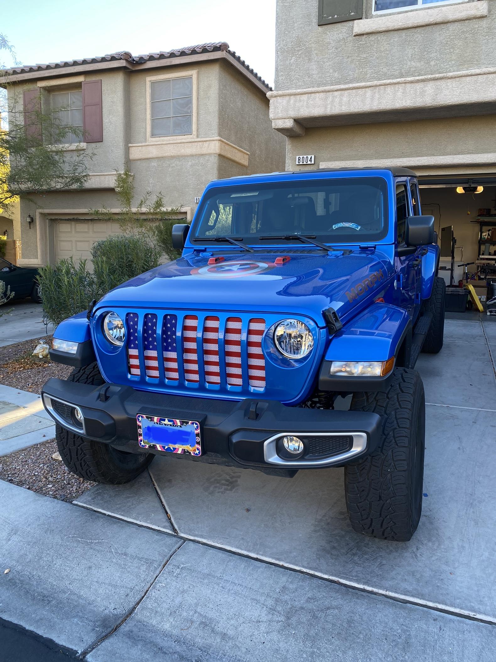 Jeep Gladiator What do you guys think of red wheels with the pearl blue 4C2C5C89-9E34-407D-B951-CBD2E6A3B257