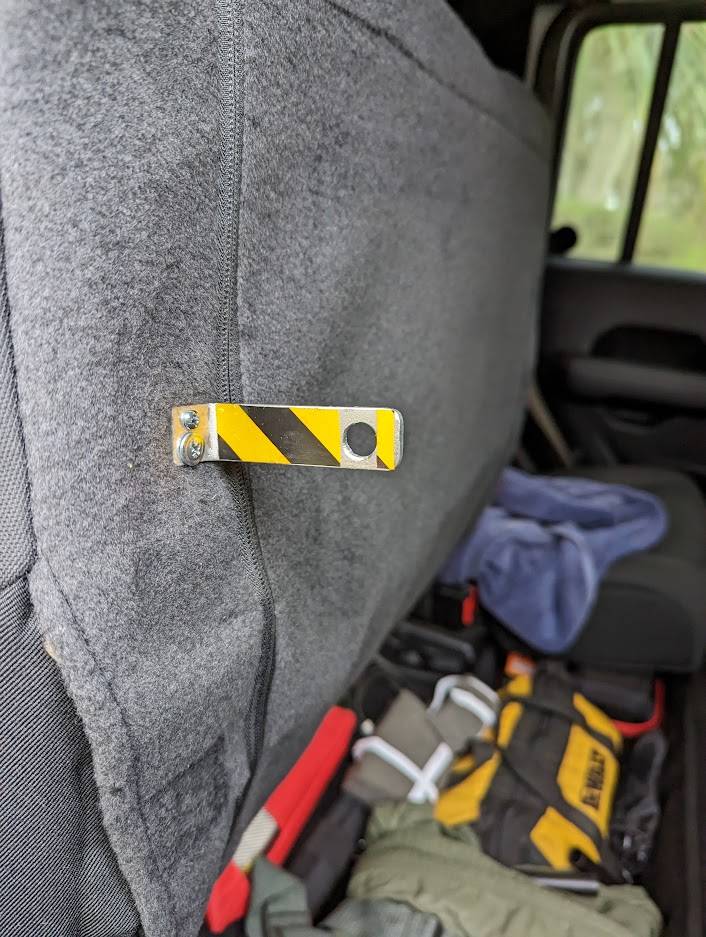 Jeep Gladiator Locking Storage under the rear seats with base plastic divider. Less than $20 PXL_20221231_130703349