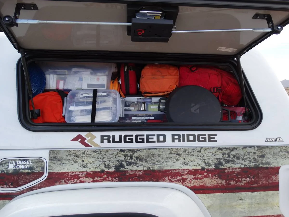 Jeep Gladiator A.R.E. CX HD Topper - Less than 2 years old  HALF Price ! 1st Aid and Kitchen gear in the drivers side Tool Box of the ARE To