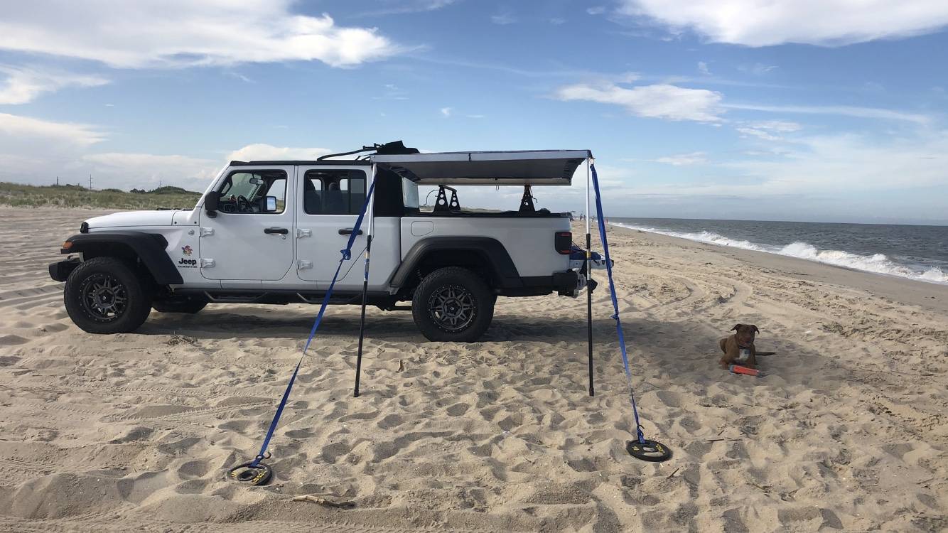 Jeep Gladiator Using an Xtrusion overland rack as a base for DIY enclosed topper... or just go Alu-Cab Contour Canopy DJ 1st beach test deployed very windy