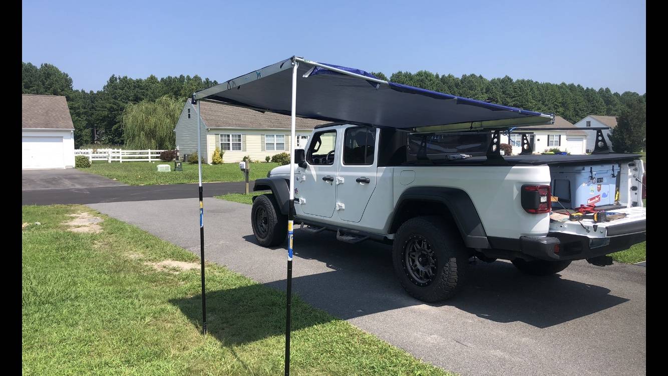 Jeep Gladiator Using an Xtrusion overland rack as a base for DIY enclosed topper... or just go Alu-Cab Contour Canopy DJ test open driveway awning deployed