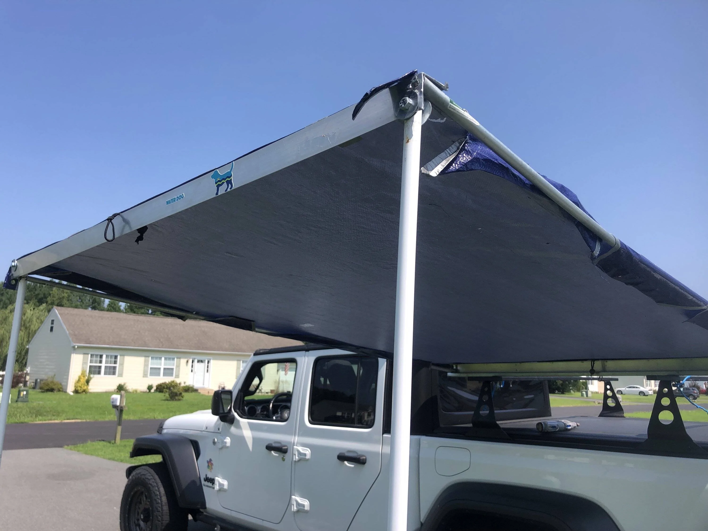 Jeep Gladiator Using an Xtrusion overland rack as a base for DIY enclosed topper... or just go Alu-Cab Contour Canopy DJ driveway close up corners