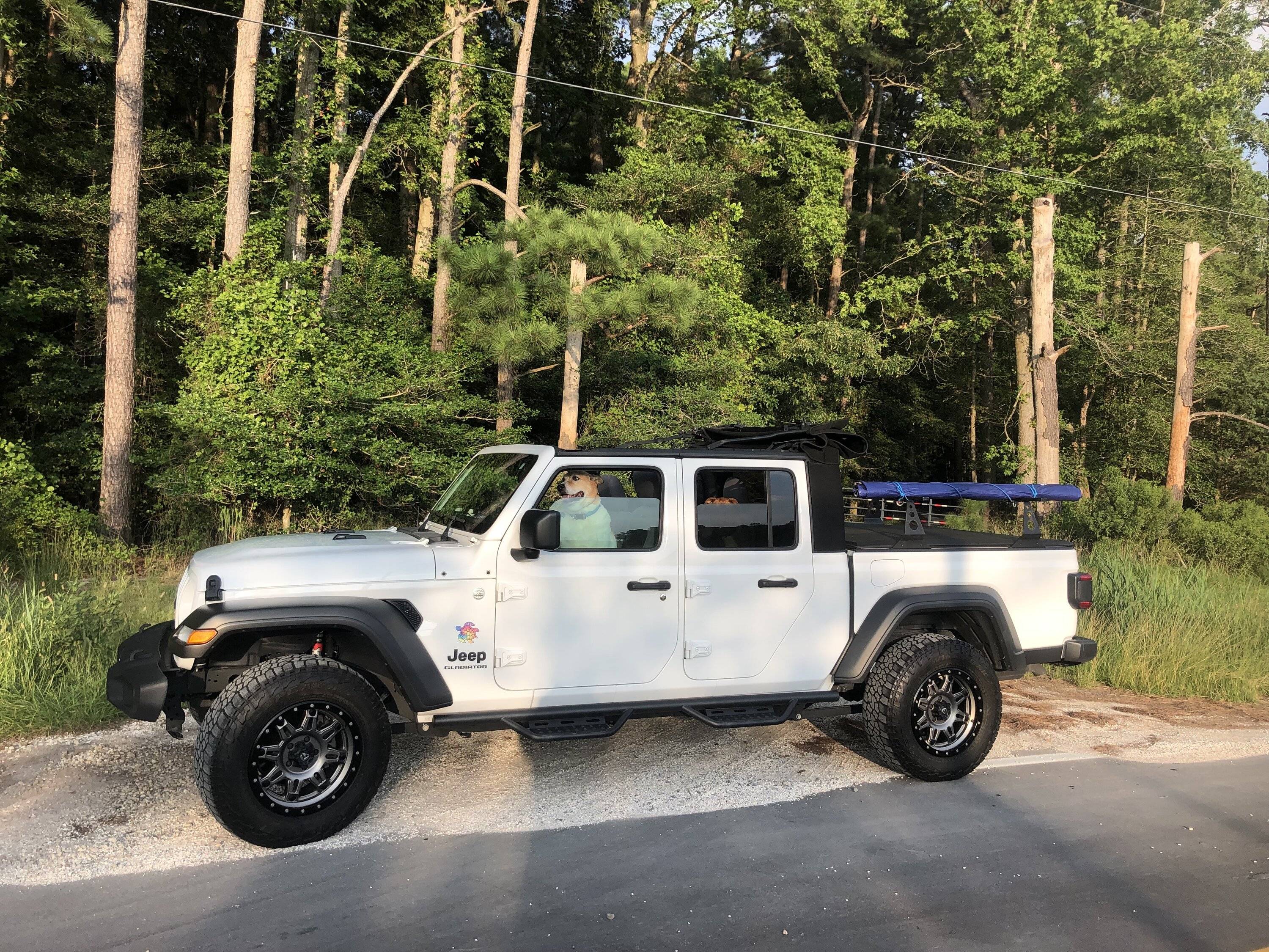 Jeep Gladiator Using an Xtrusion overland rack as a base for DIY enclosed topper... or just go Alu-Cab Contour Canopy DJ side shot2 rolled up awnin
