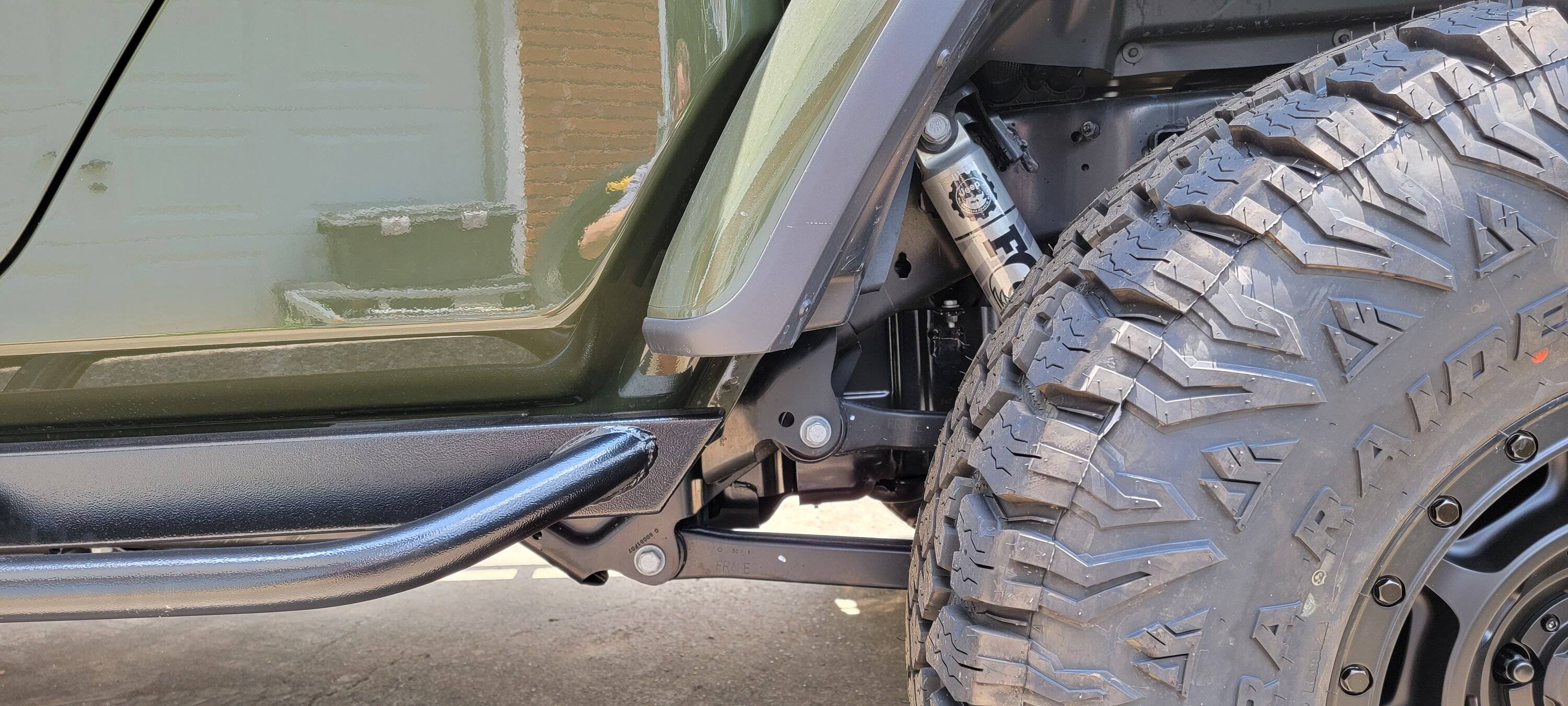 Jeep Gladiator Rock Hard VS White Knuckle Sliders RearSideFar