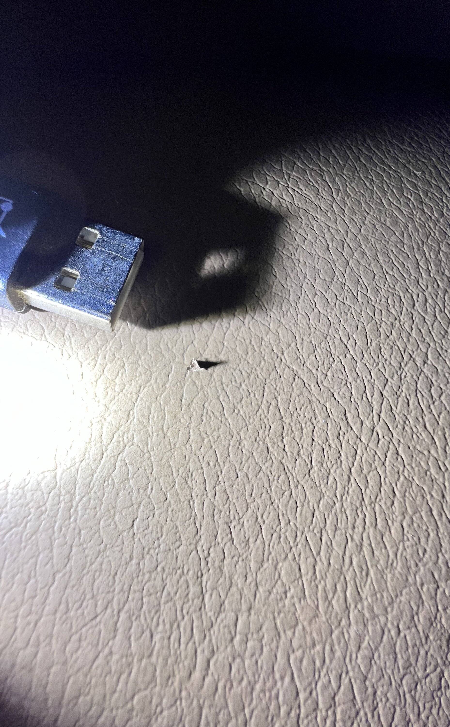 Jeep Gladiator Very small tear on leather seat IMG_4502