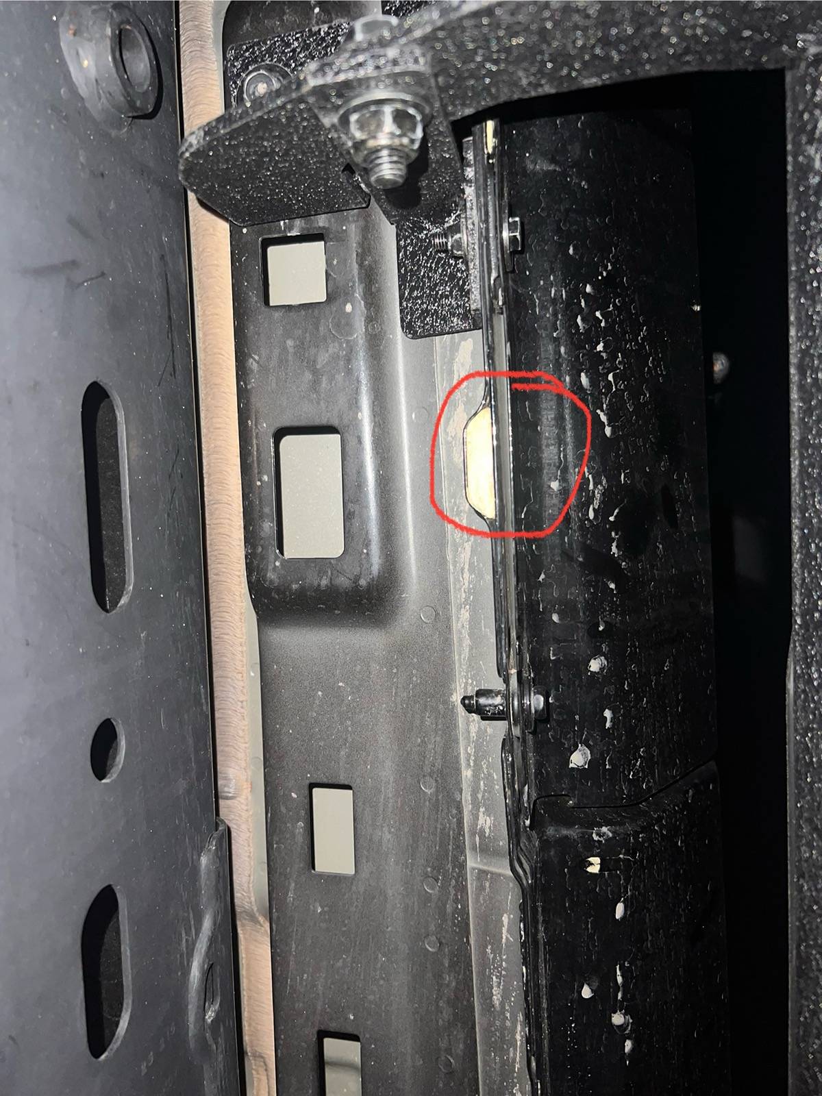 Jeep Gladiator Drain hole under driver side door filled with spray foam IMG_6808