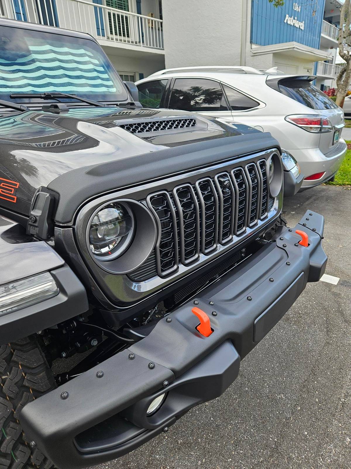 Jeep Gladiator 2024 Grille on my Firecracker Red 2020 JTR Hood Deflector