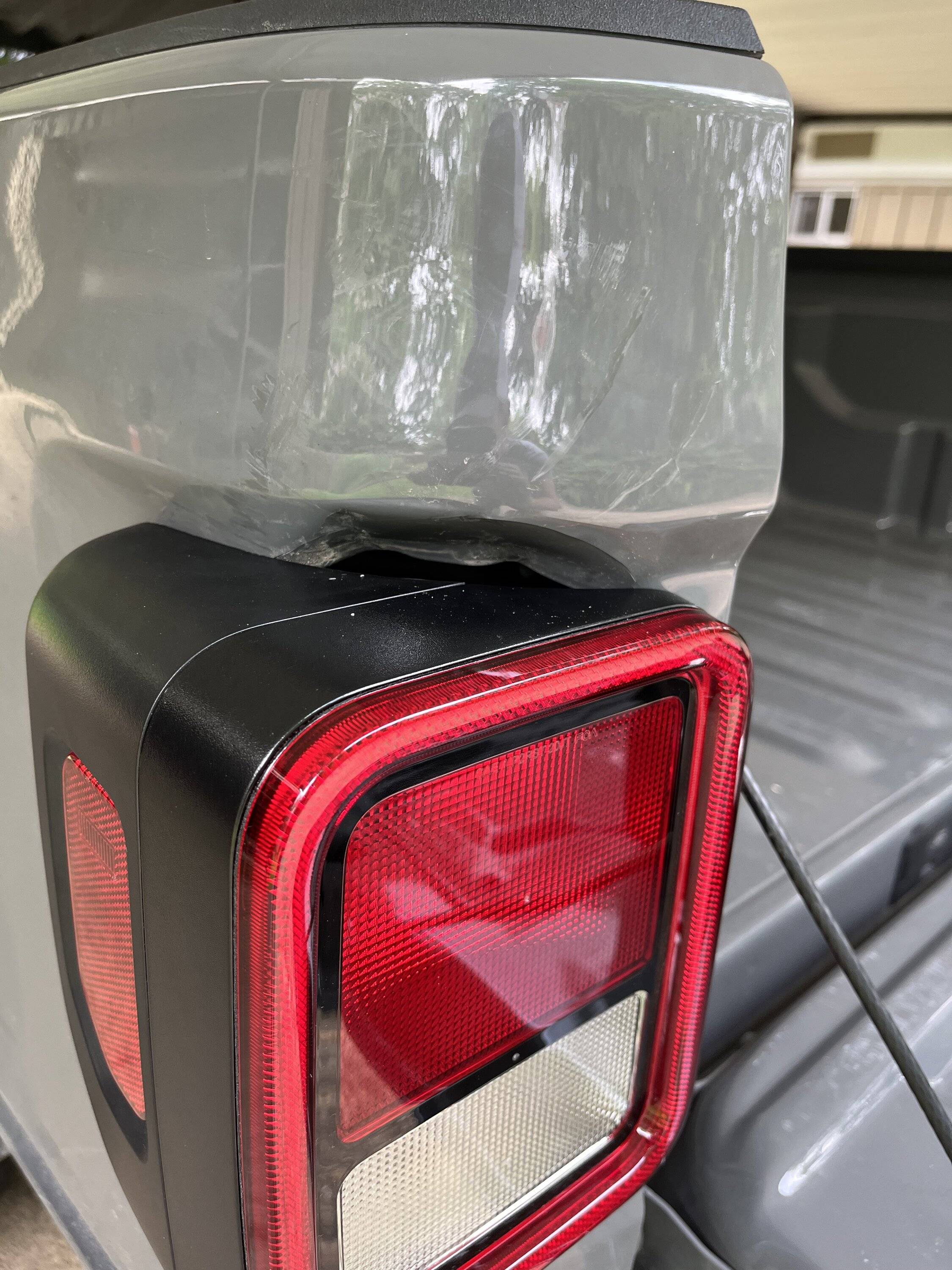 Jeep Gladiator Smashed taillight and dent IMG_4939