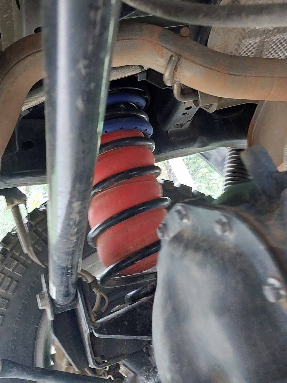 Jeep Gladiator Going to see if airbags will help with rooftop tent seaying suspension. 20241102_142218