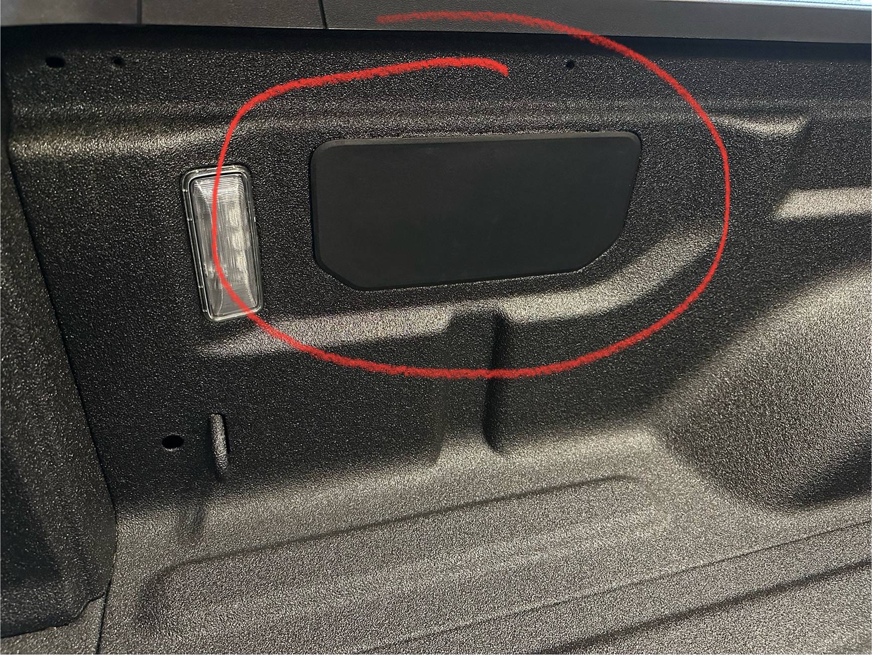 Jeep Gladiator Black plastic cover on left wall of bed. What is this for? IMG_3880