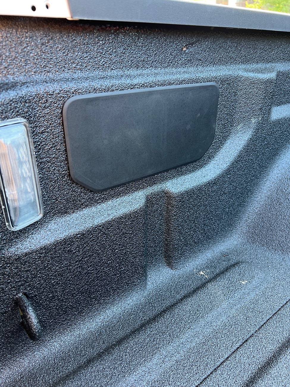 Jeep Gladiator What is this panel for in the bed on the driver side? IMG_8808
