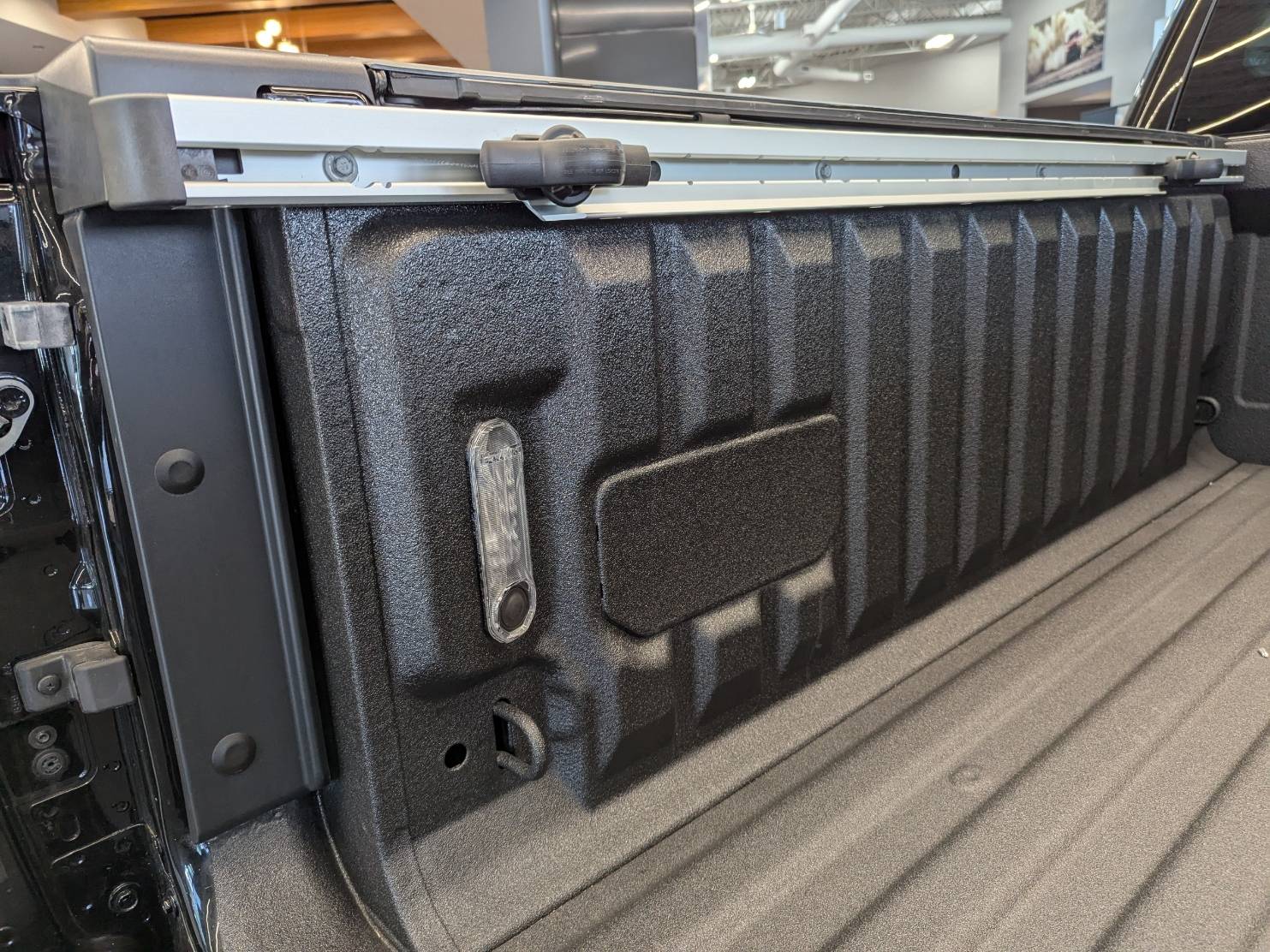 Jeep Gladiator What is this panel for in the bed on the driver side? PXL_20250409_154138080
