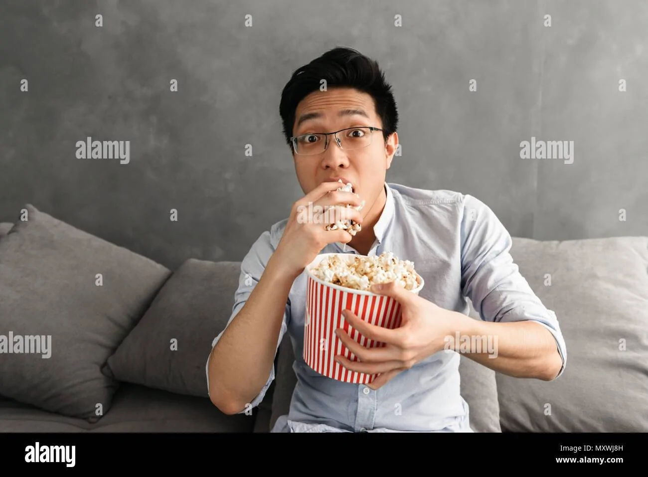 Jeep Gladiator Oil - going from 0w20 to 0w40 portrait-of-a-scared-young-asian-man-eating-popcorn-while-sitting-on-a-couch-at-home-and-watc