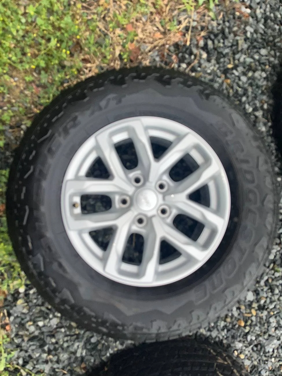 Jeep Gladiator 5 Duelers, 2023 Sport wheels/tires, 11k miles, zero on spare. $300.00 for all 5 wheels and tires. IMG_9710