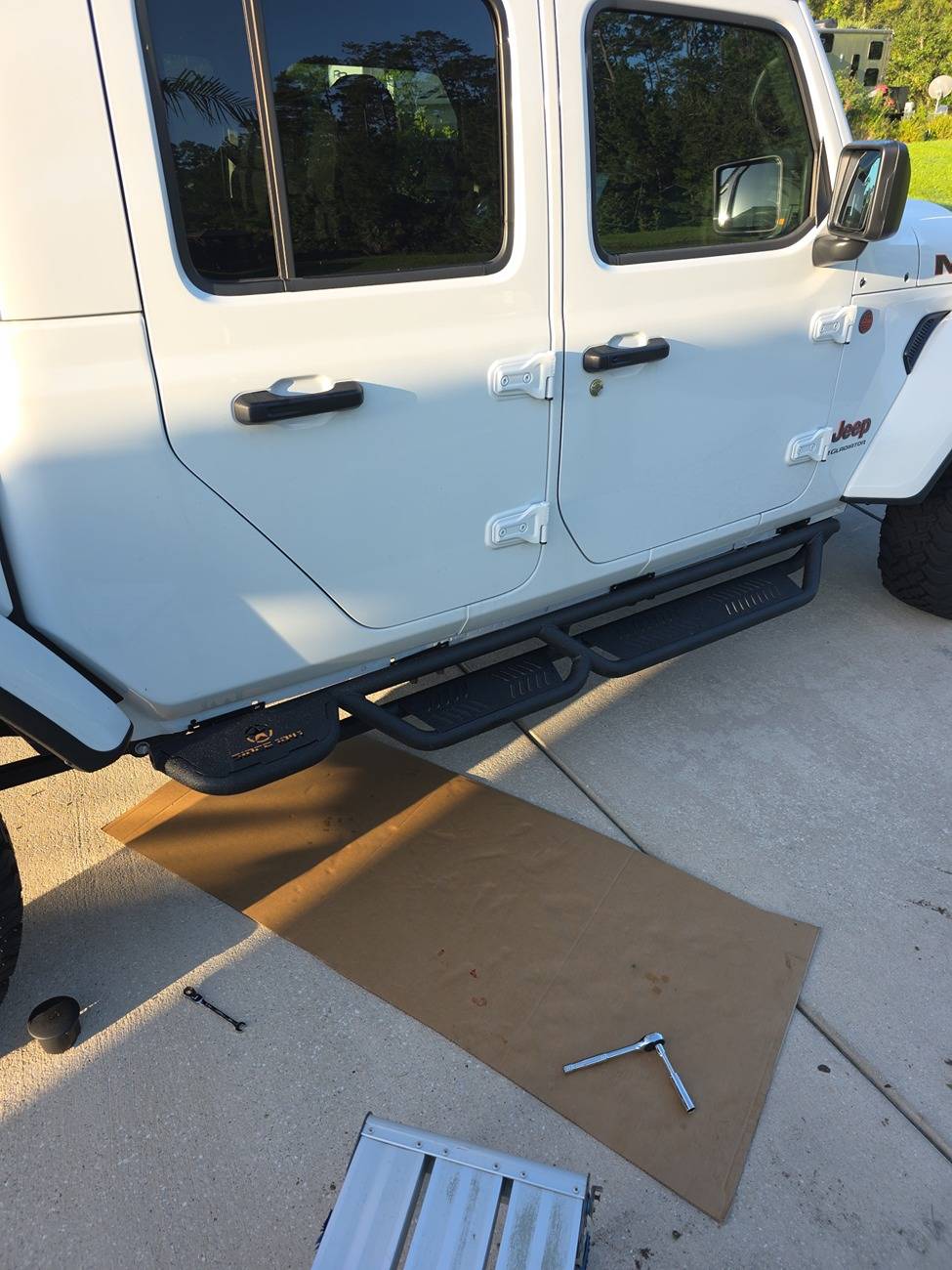 Jeep Gladiator Do I have to take the rock rails off to put step bars on my Gladiator? Rock Guards