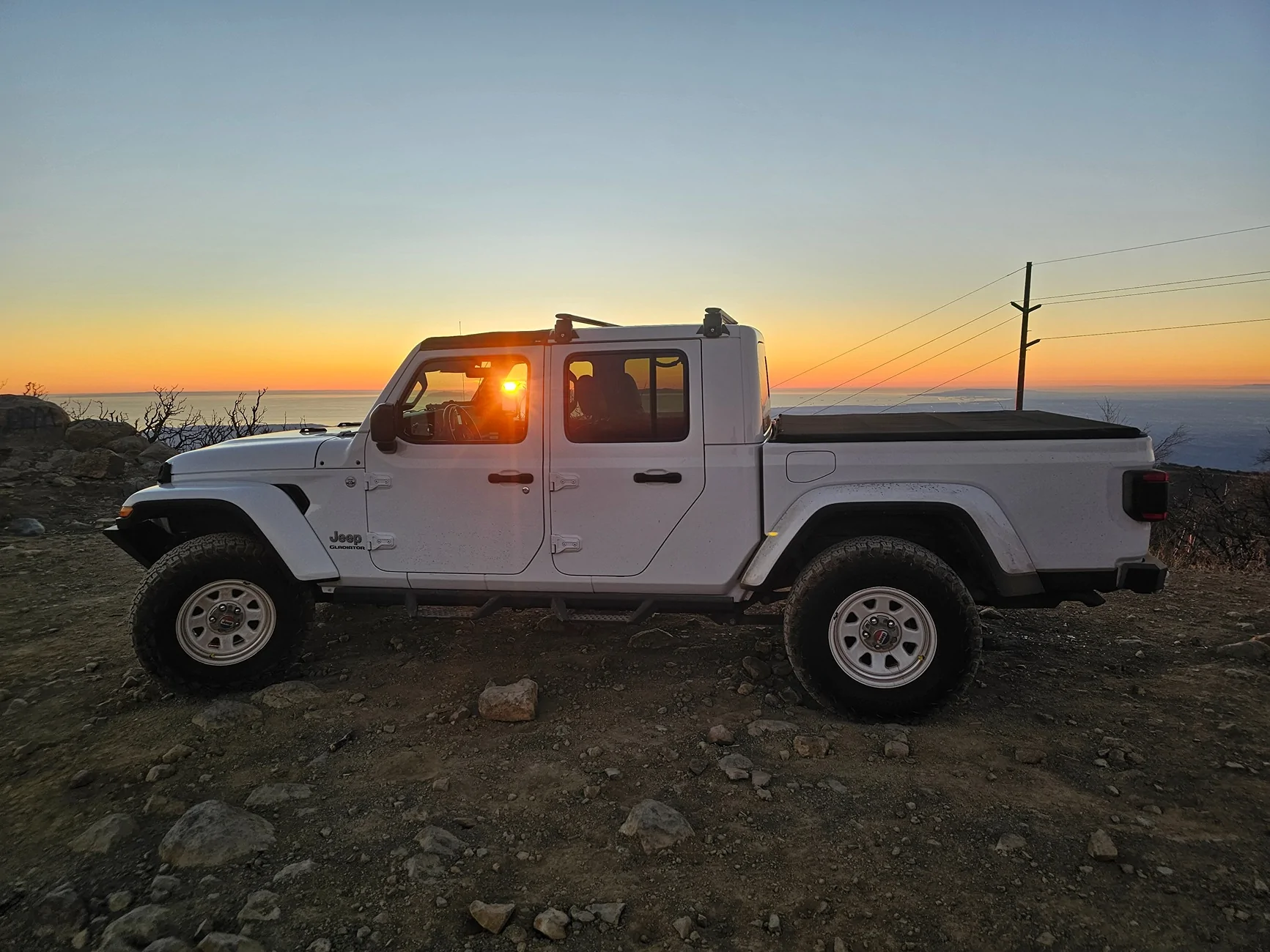 Jeep Gladiator Anybody have pics of Sport gladiators on 35s with just a leveling kit? Thanks 20251206_164631