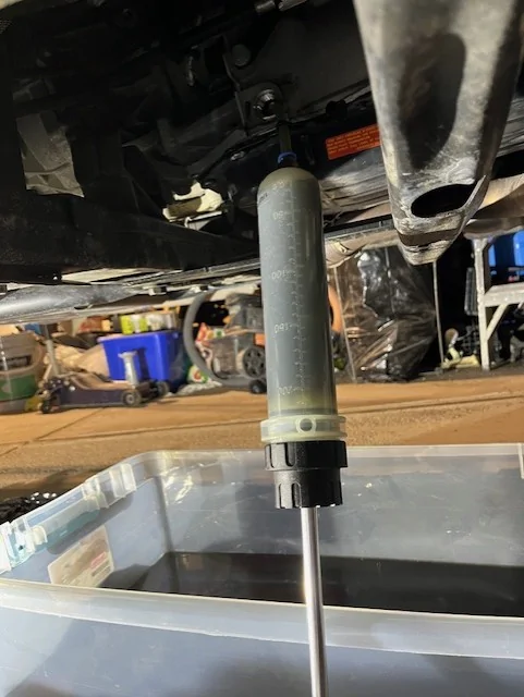 Jeep Gladiator Pan Drop / Drain & Fill Instructions for ZF 8HP50 or Chrysler TorqueFlite 850RE Automatic Transmission pan_drop_070_old_fluid_below_fill_hole_(3_to_4_quarts)_being_extracted_thru_fill_hole_to_empt