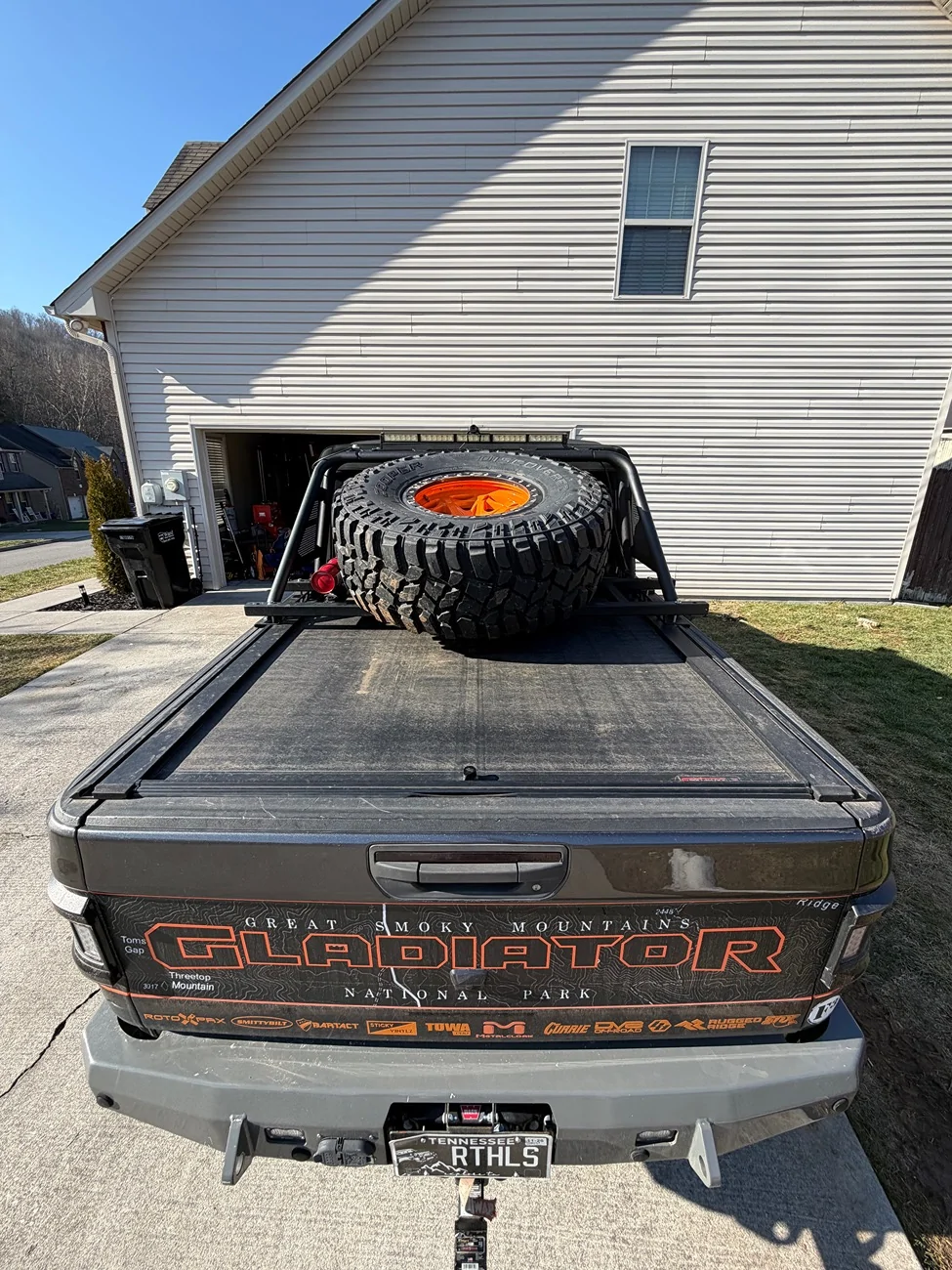 Jeep Gladiator Roll n lock bed cover with n fab rack and tire carrier IMG_0340
