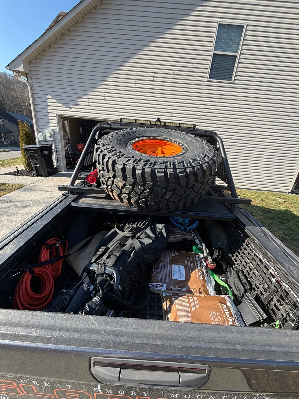 Jeep Gladiator Roll n lock bed cover with n fab rack and tire carrier IMG_0341