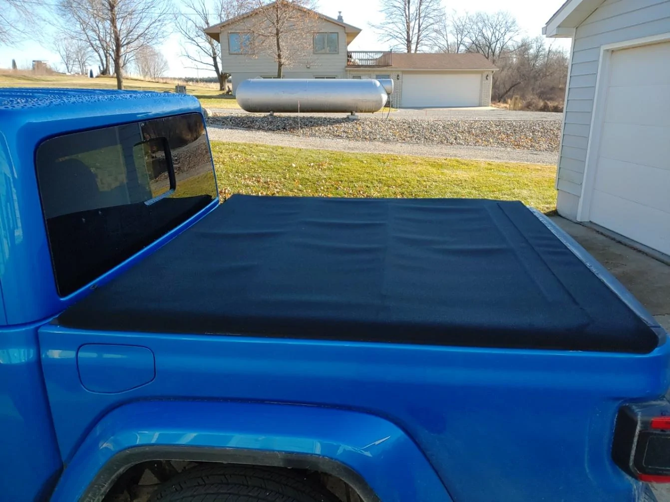 Jeep Gladiator How do you adjust factory tonneau cover? cover-left
