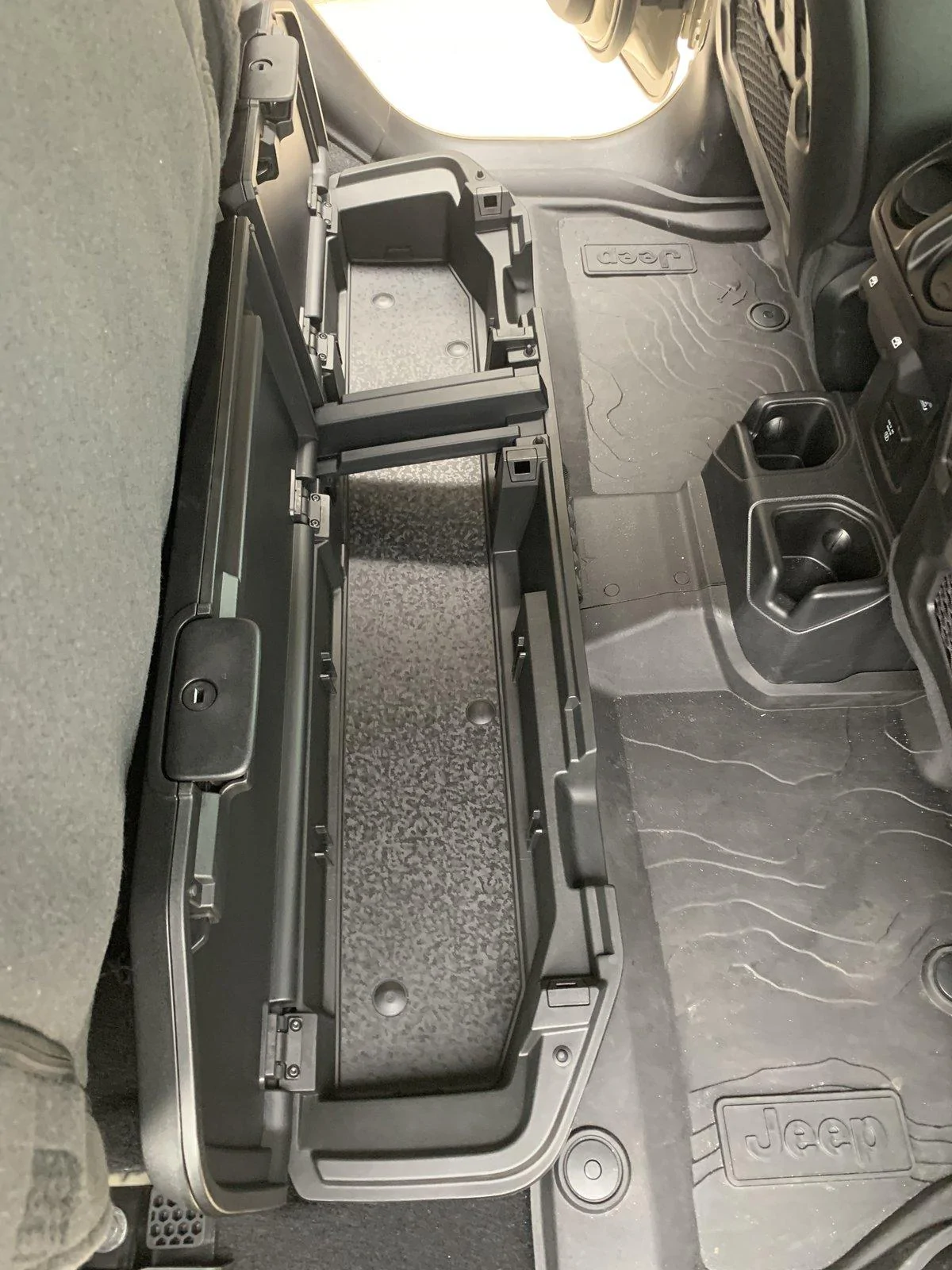 Jeep Gladiator New OEM under seat storage box. A8DED274-BDDB-4549-AA96-9D0D95383318