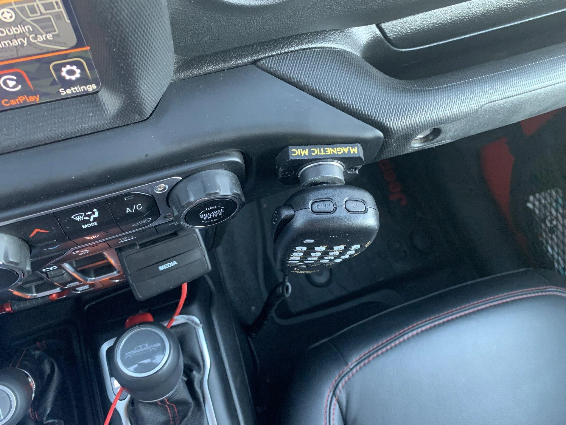 Jeep Gladiator How do I get a CB/HAM microphone mounted here?  Has anyone drilled it? IMG_2881