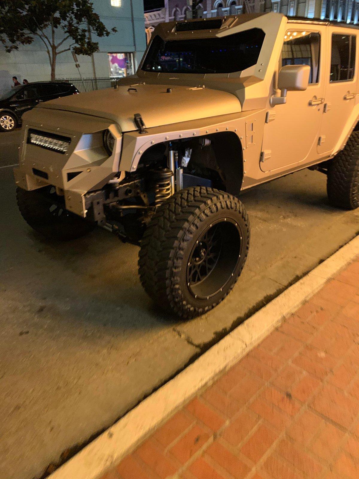Jeep Gladiator Because the regular frowny-clown grills aren't bad enough, there's this abomination IMG_0431