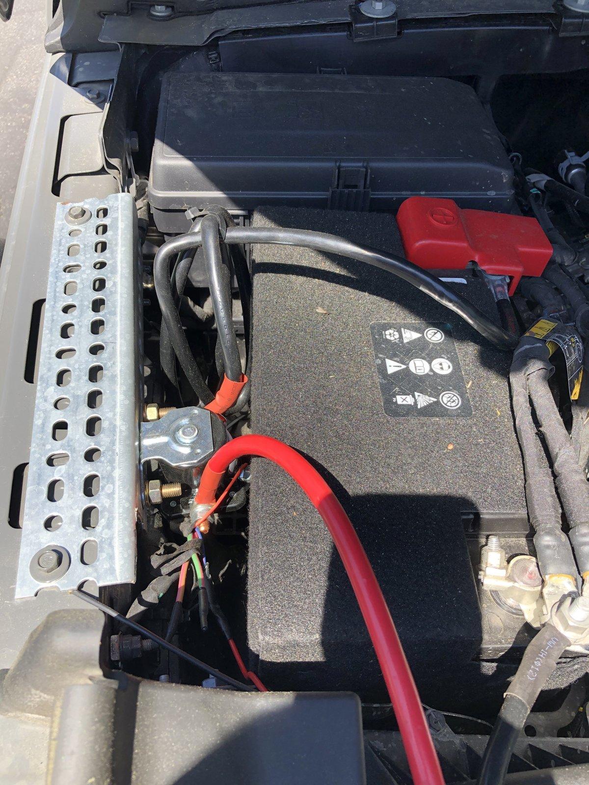 Jeep Gladiator Does anyone know of a bracket / wire holder that fits between the battery and passenger fender in the engine bay? IMG_1277