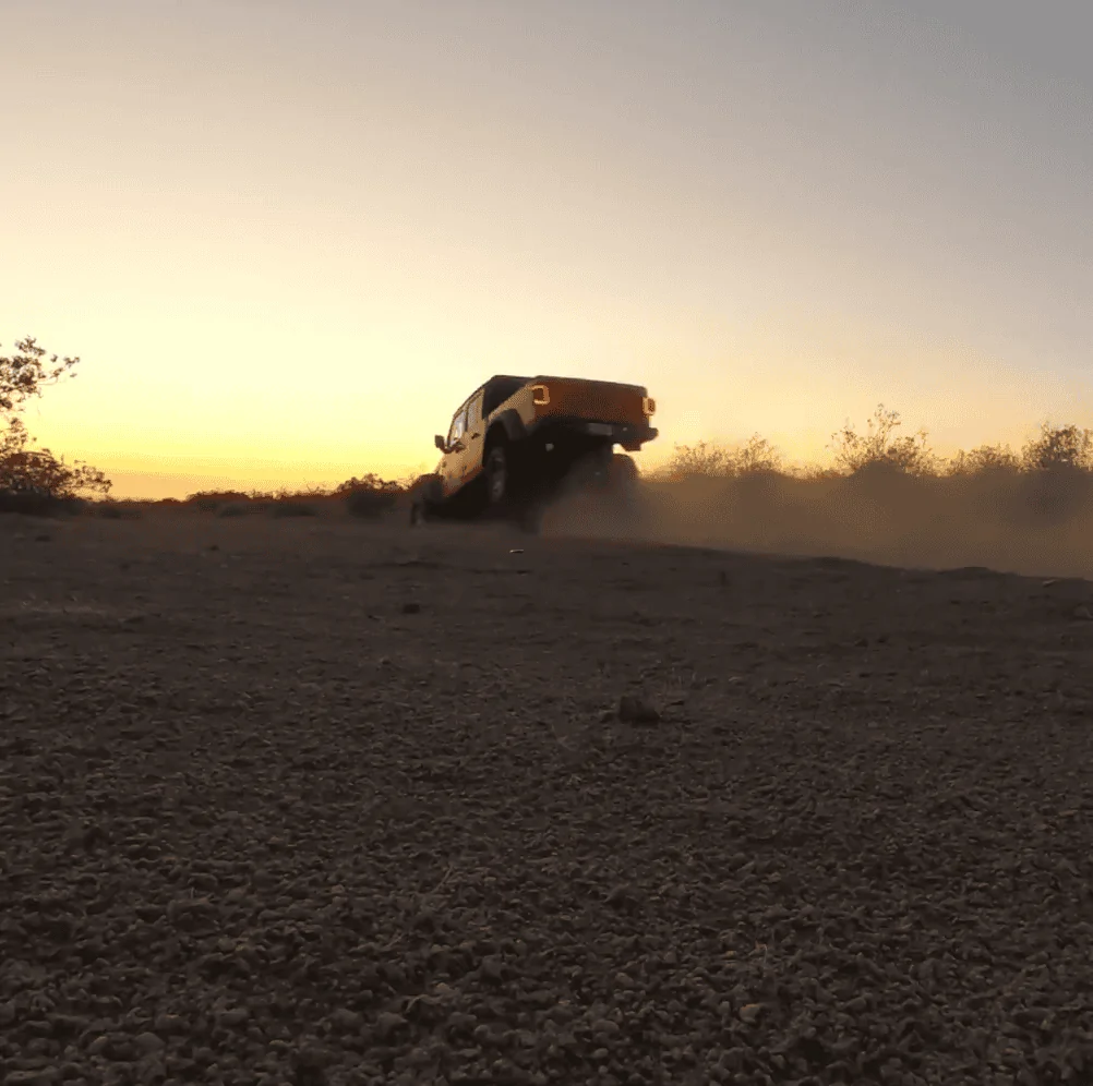 Jeep Gladiator Mojave goes airborne, shocks bottoming out; pretty impressive, no bent-frame. 1596859649978