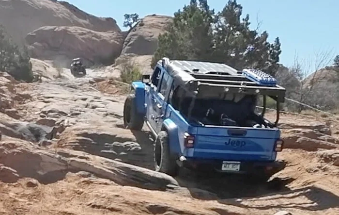Gladiator and Rivian on the Same Fins N Things Step in Moab....
