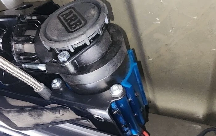 ARB Twin Compressor Installed -- mounted under bed, above spare