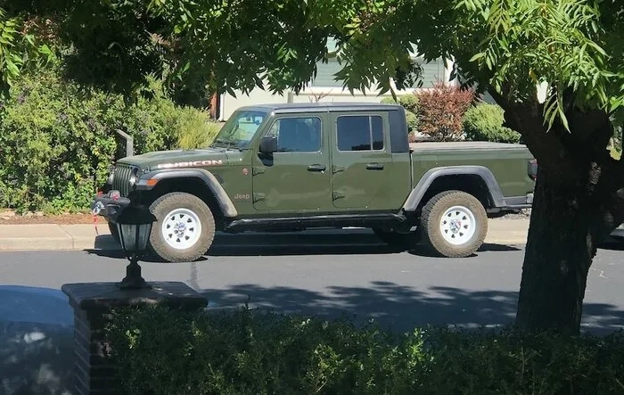White CJ retro wheels on a Sarge Green Gladiator