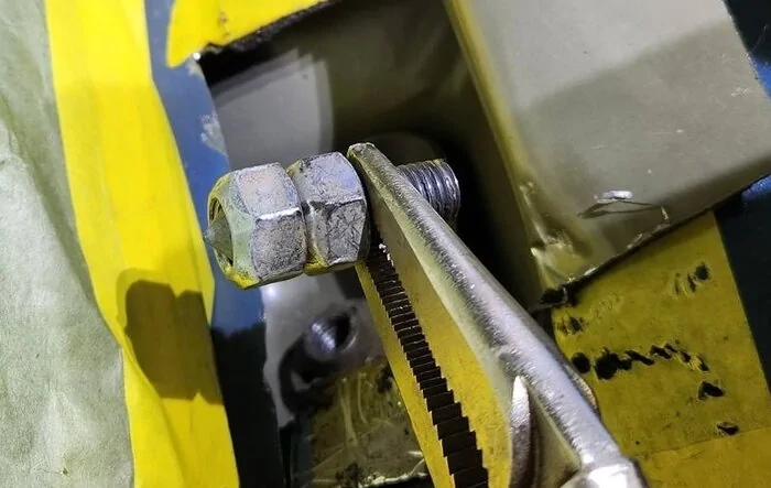 DIY: Remove and replace drivers broken body mount bolt -- how-to instructions w/ photos
