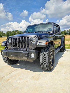 Bigger tires, side step, stubby bumper, window guard.